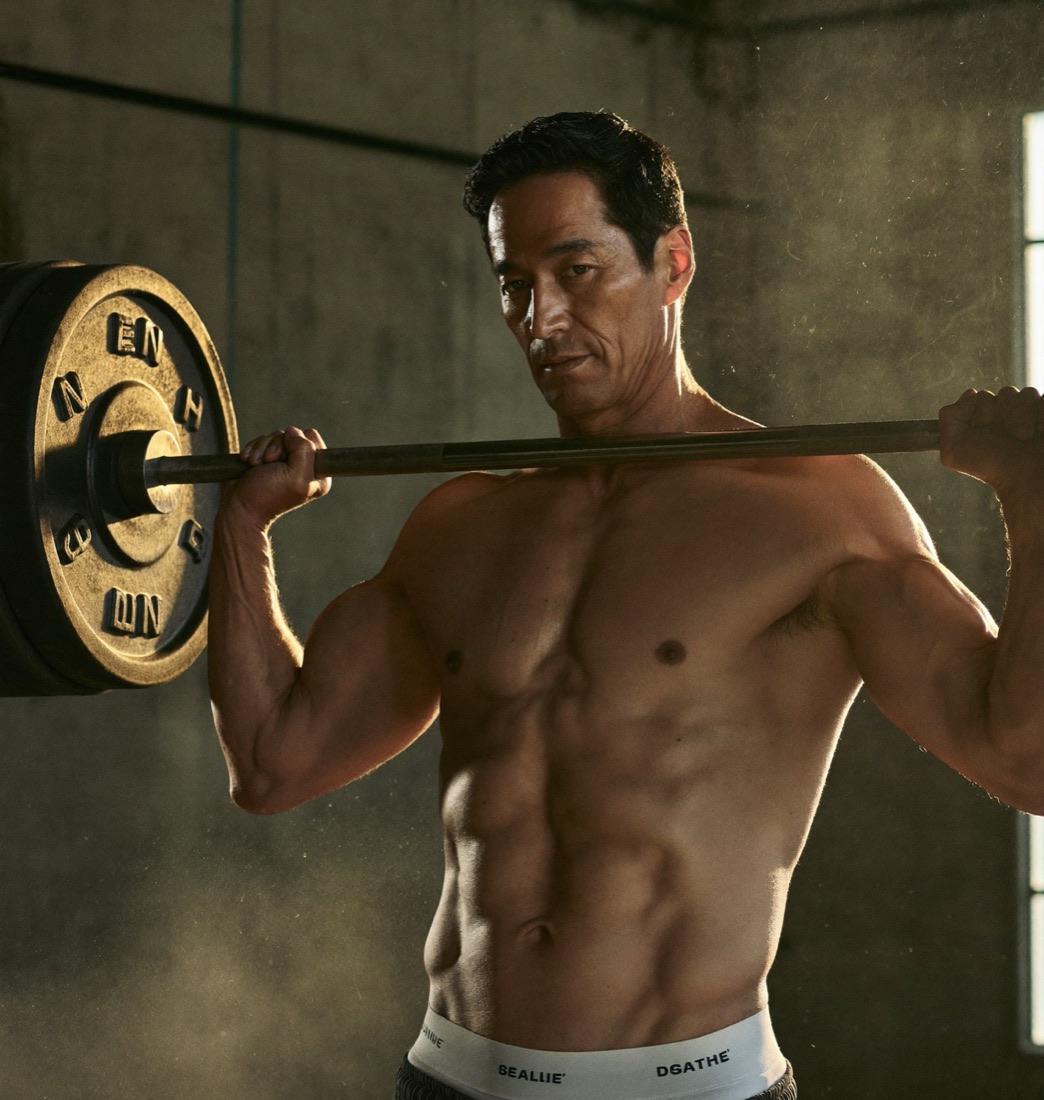 A powerful 50-year-old man mid-lift